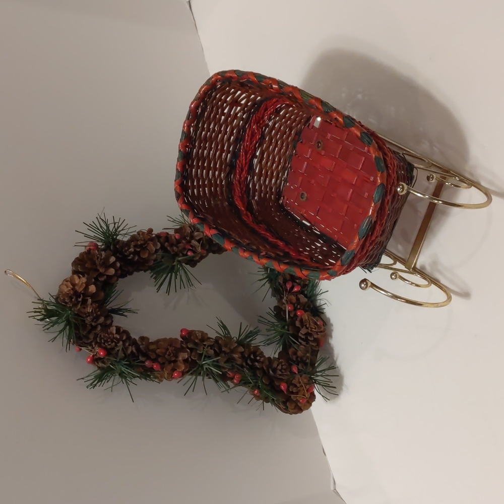 Wicker Sleigh Green and Red Shiny Gold Runners and Pinecone Bell Shaped Wreath